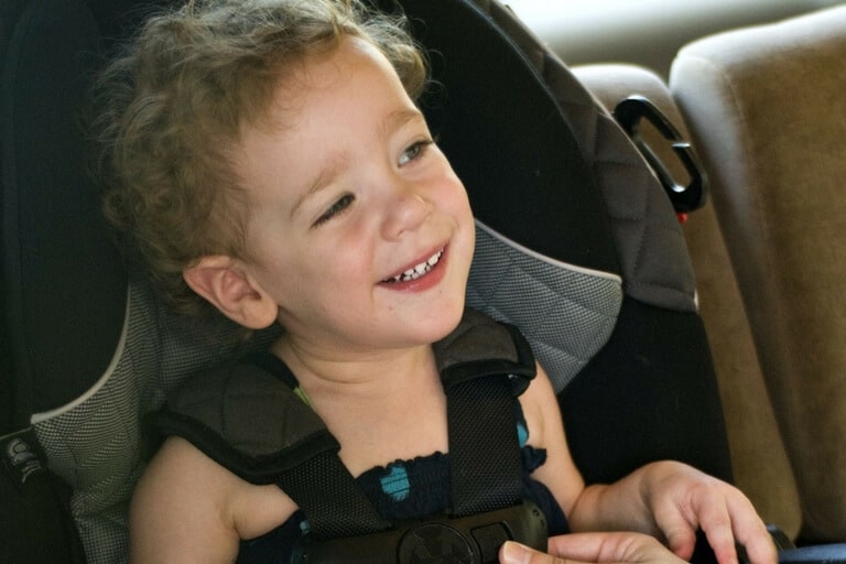 a child on a car seat close up