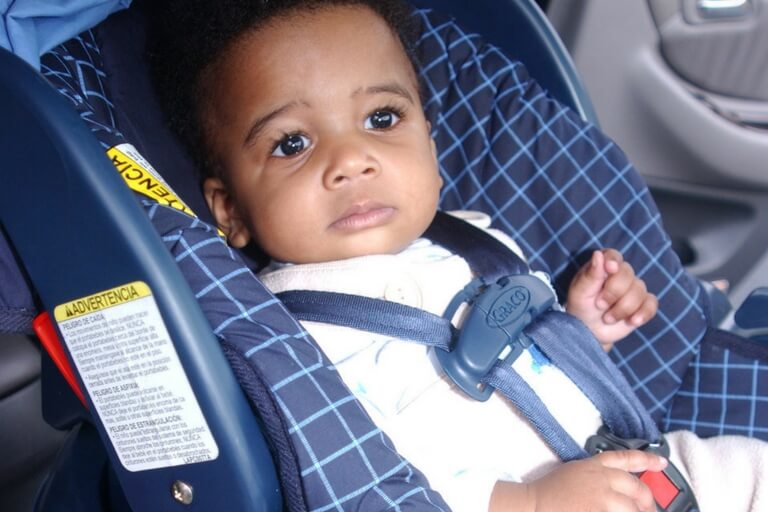 infant on a car seat