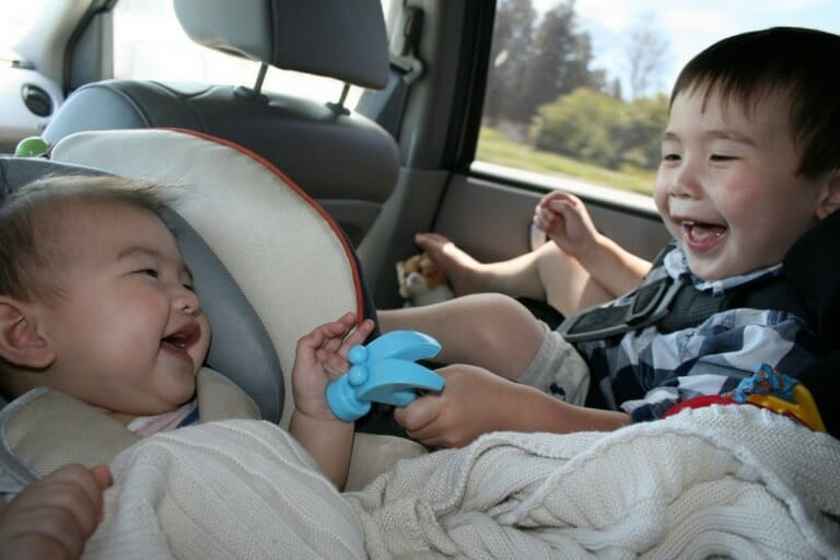 babies in car seats playing