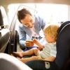 Father with son on car seat