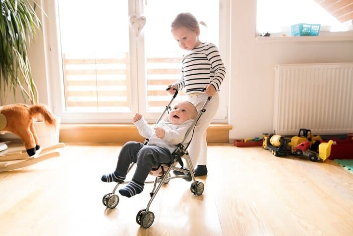 little-girl-at-home-with-baby-brother