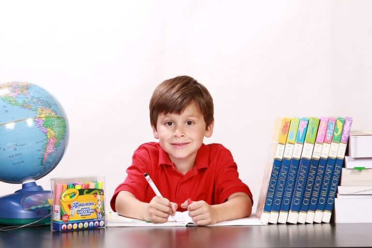 Young learner surrounded with books
