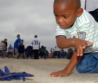 Toddler playing with a plane