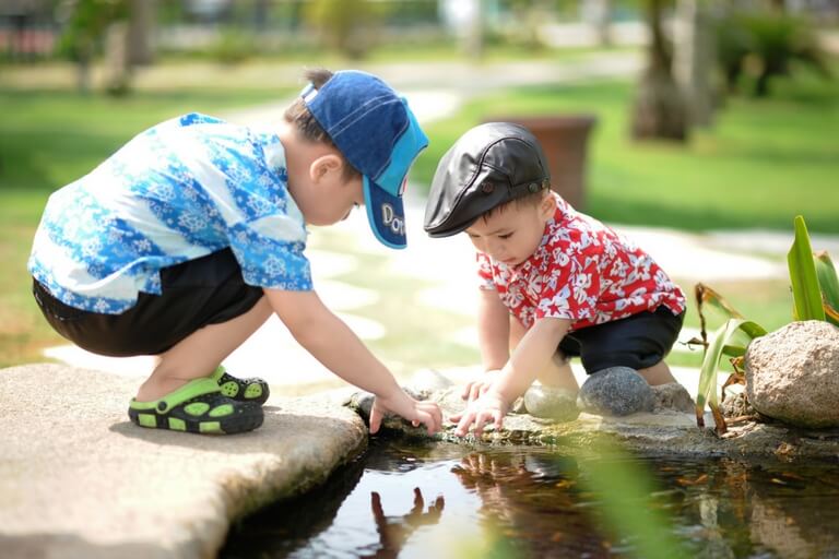 two boys playing outside