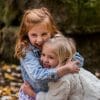 two girls hugging and playing