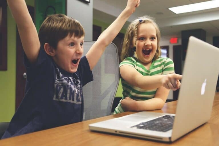 two children with a laptop