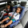 two toddlers on car seats