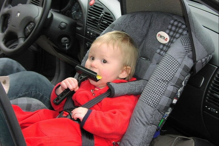 baby on a car seat