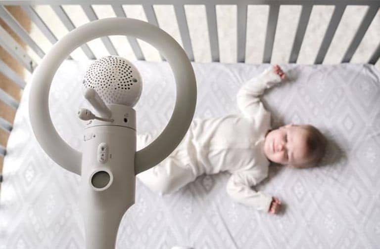 baby in the bed with monitor