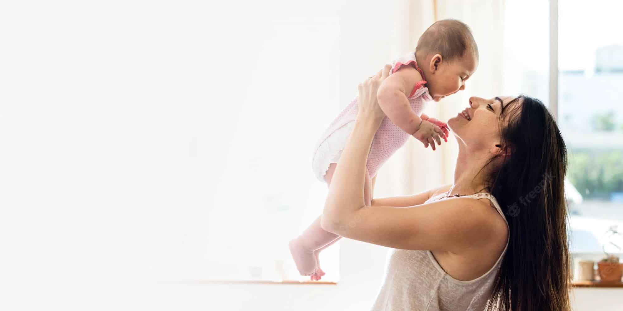 A mother holding her baby A mother holding her baby